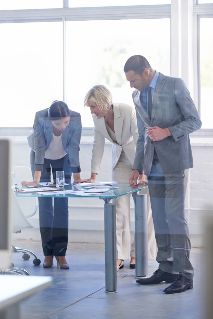 Two professionals working together on joint project planning.